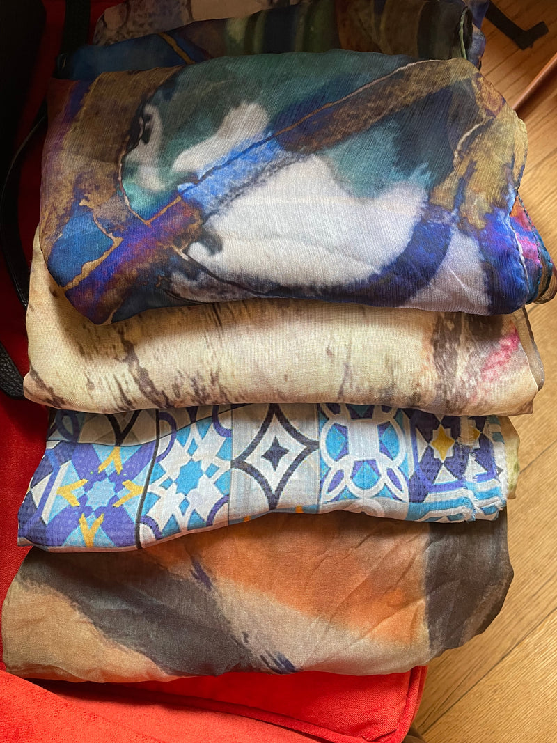 An assortment of favored Mila+Mate scarves